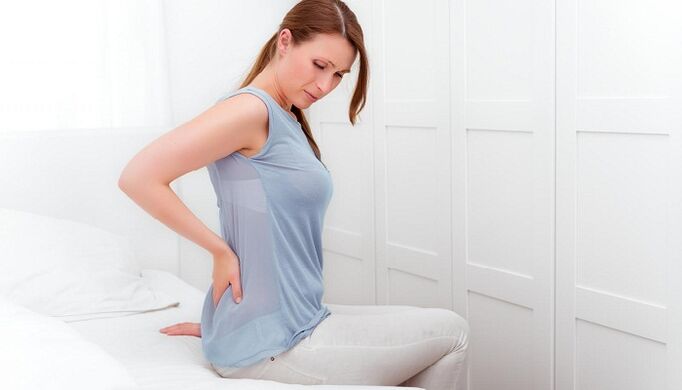 Woman is worried about back pain